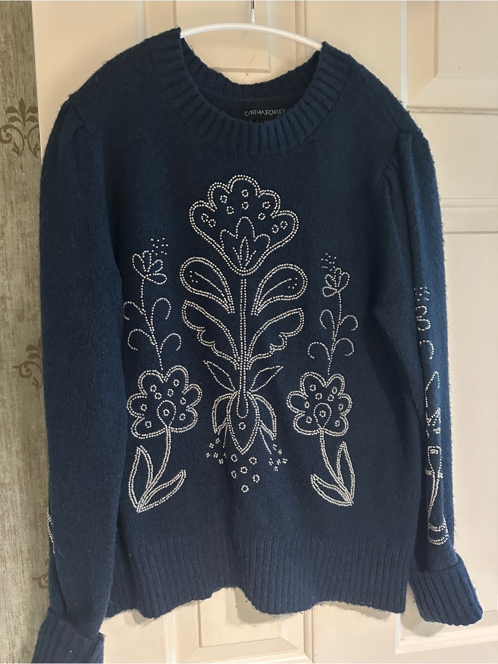 Navy blue med weight sweater with silver sparkly design. ( not too sparkly)
